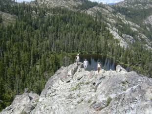 mountains and three people